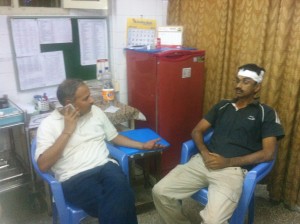 A Karyakarta at Hospital with minor injuries explaining the details