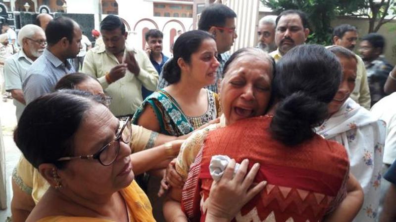 Gagneja’s wife, Sudesh, cries at their residence in Jalandhar Cantt on Thursday. 