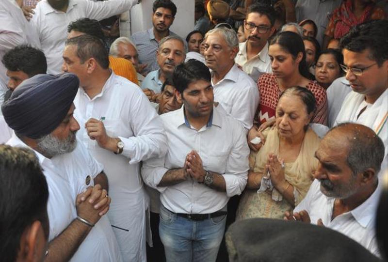 Punjab deputy chief minister Sukhbir Singh Badal consoles the family of state RSS unit vice-president Brig Jagdish Gagneja (retd) after his cremation in Jalandhar on Thursday.